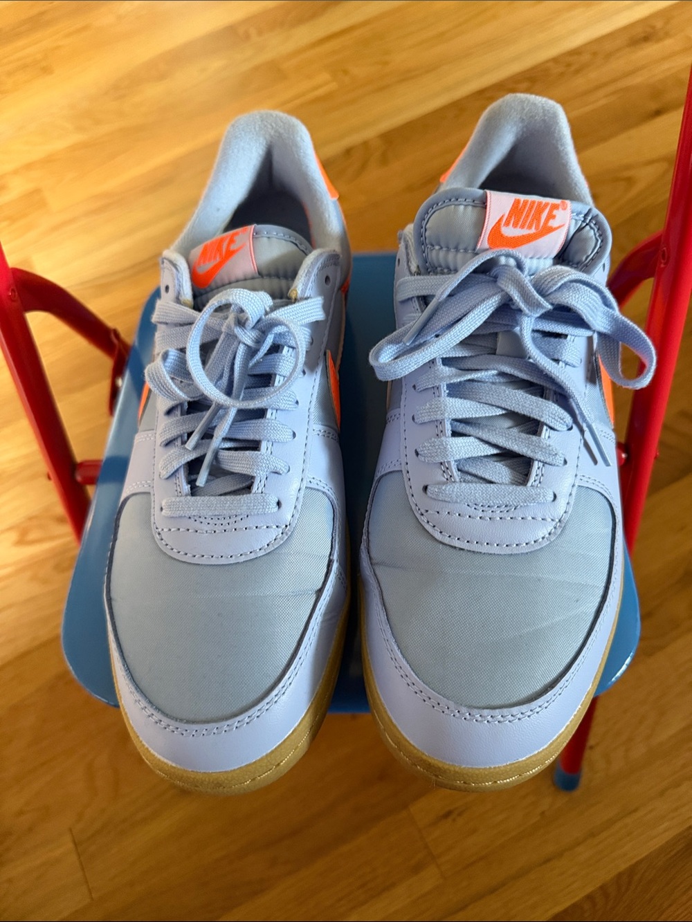 Nike Light Blue and Orange Athletic Shoes with Gold Accents
